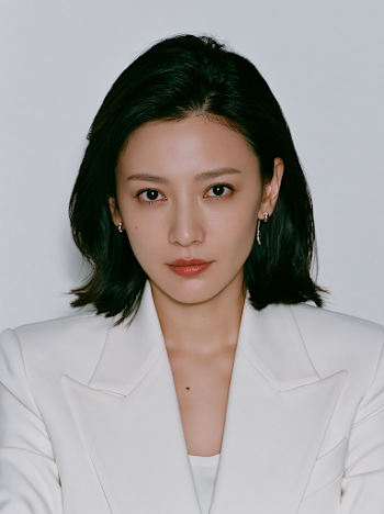 Confident East Asian Woman in Minimalist Luxury Fashion
