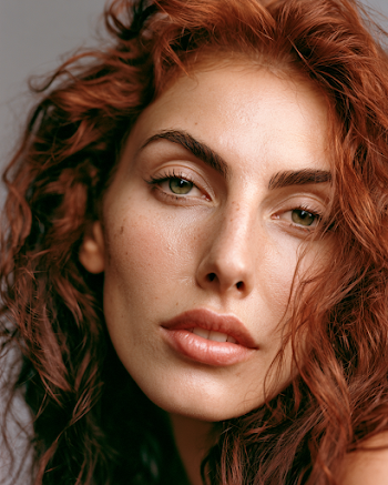 Confident Portrait of a Young Woman with Rich Copper Hair