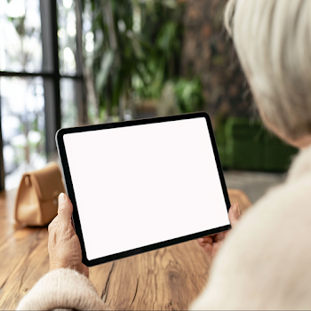 Cozy Cafe Scene with Woman Holding Tablet