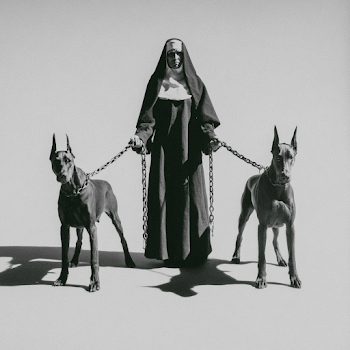 Dominion: A Nun with Guarding Doberman Pinschers