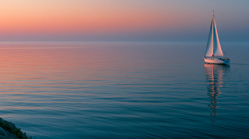 Dreamy Sunset Over Calm Ocean with Sailboat