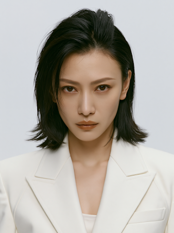 Elegant Asian Woman in Tailored White Suit