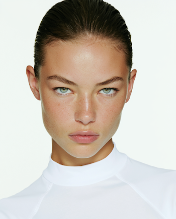 Elegant Portrait of a Young Woman in Natural Makeup
