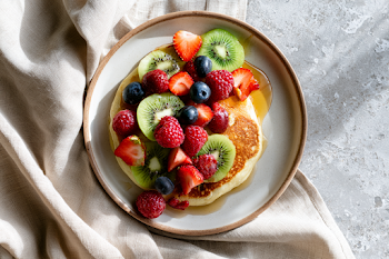 Fluffy Pancakes with Fresh Berries and Kiwi