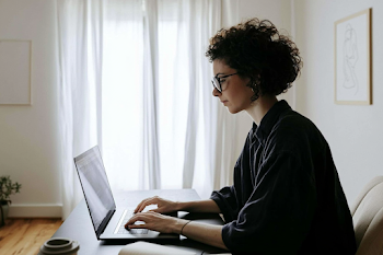 Focused Professional Woman Typing in Modern Home Office