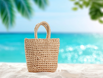 Handwoven Straw Beach Tote Bag on Tropical Sand