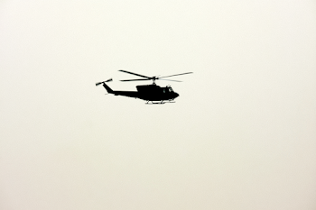 Isolated Helicopter in Pale Overcast Sky