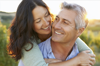 Joyful Moments in a Vineyard: A Loving Couple Embracing