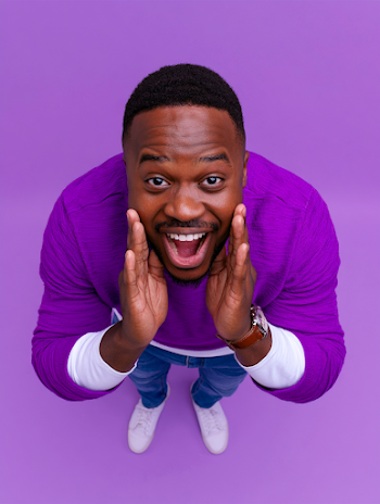 Joyful Young Black Man Shouting in Studio Portrait