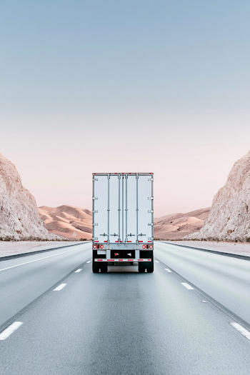 Rear View of Truck on Desert Highway