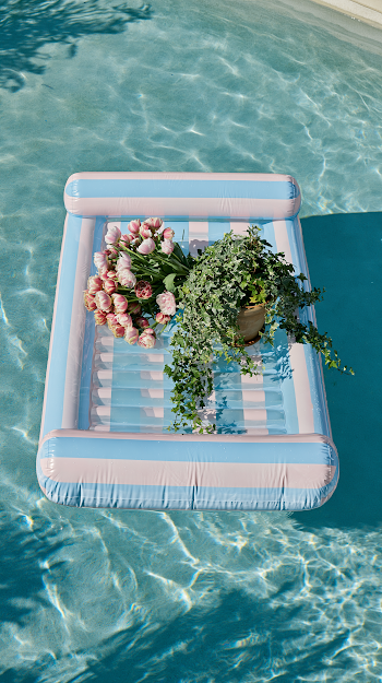 Serene Summer Oasis: Inflatable Mattress in Blue Pool