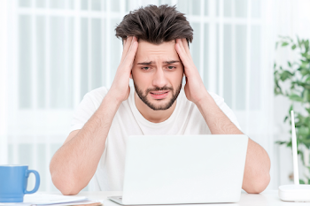 Stressed Young Adult Man Working from Home