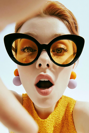 Surprised Young Woman in Oversized Cat-Eye Sunglasses