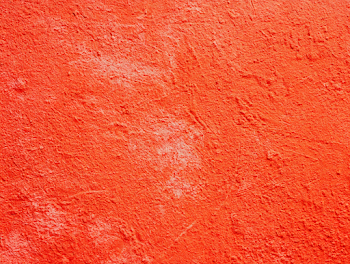 Vivid Red-Orange Stucco Wall Texture