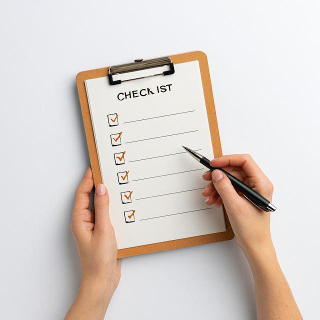 Checklist on a Clipboard with Pen