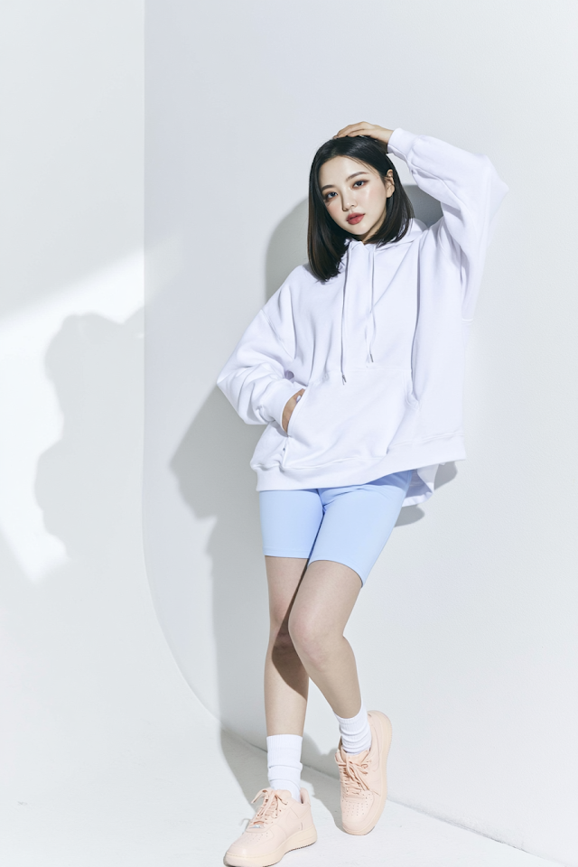 Chic full-body fashion portrait of a young East Asian woman