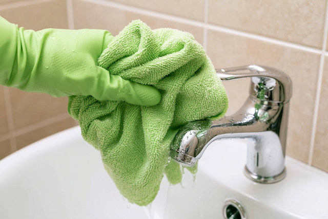 Clean and Shine: Close-up of Bathroom Faucet Cleaning