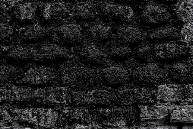 Close-Up of Weathered Rough Stone Wall