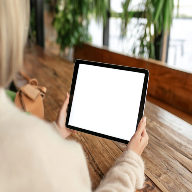 Cozy Cafe Scene: Woman with Tablet