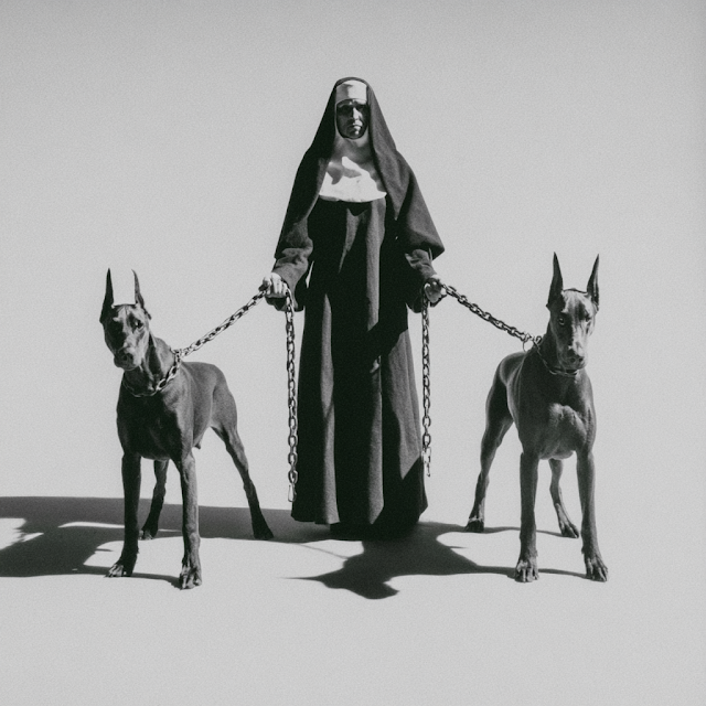 Dominion: A Nun with Guarding Doberman Pinschers