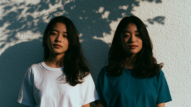 Elegant Asian Females in Sunlit Portrait
