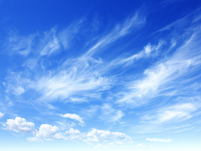 Expansive Blue Sky with Wispy Clouds