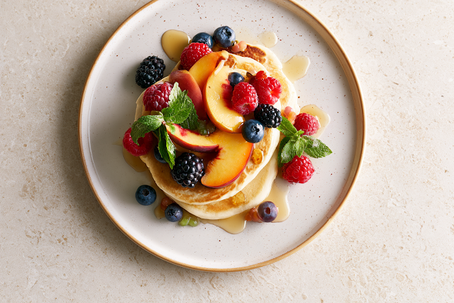 Fluffy American Pancakes with Fresh Berries and Peach