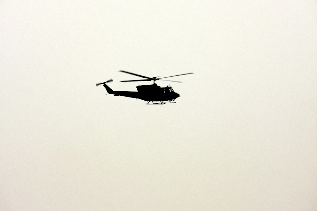 Isolated Helicopter in Pale Overcast Sky