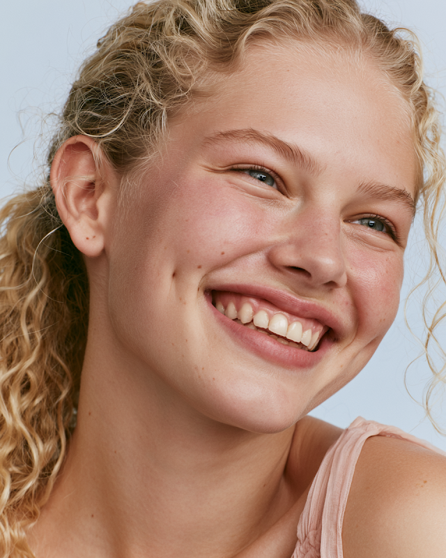 Joyful Blonde Woman in Summer Beauty Shoot