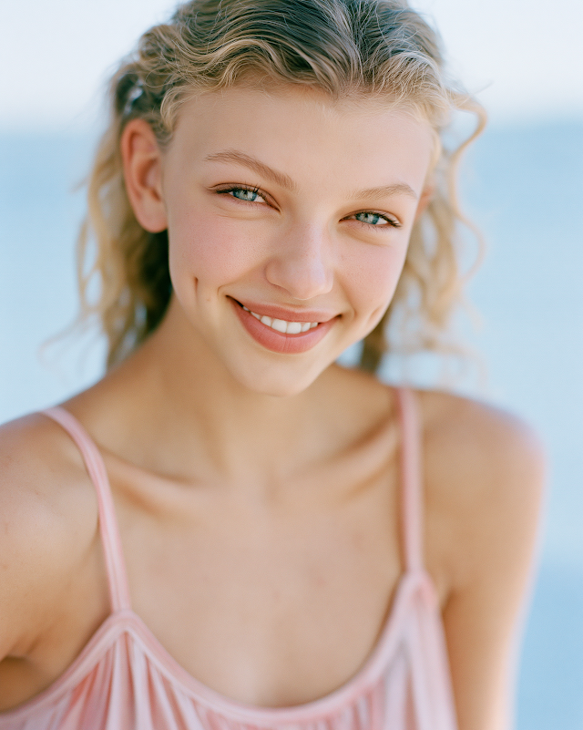 Joyful Blonde Woman in Summer Dress