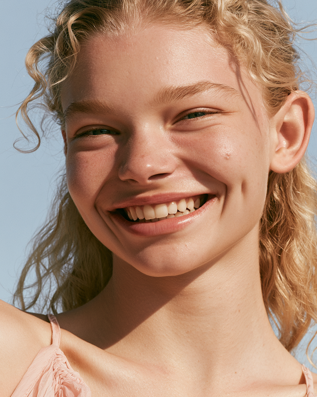 Joyful Blonde Woman in Summer Portrait