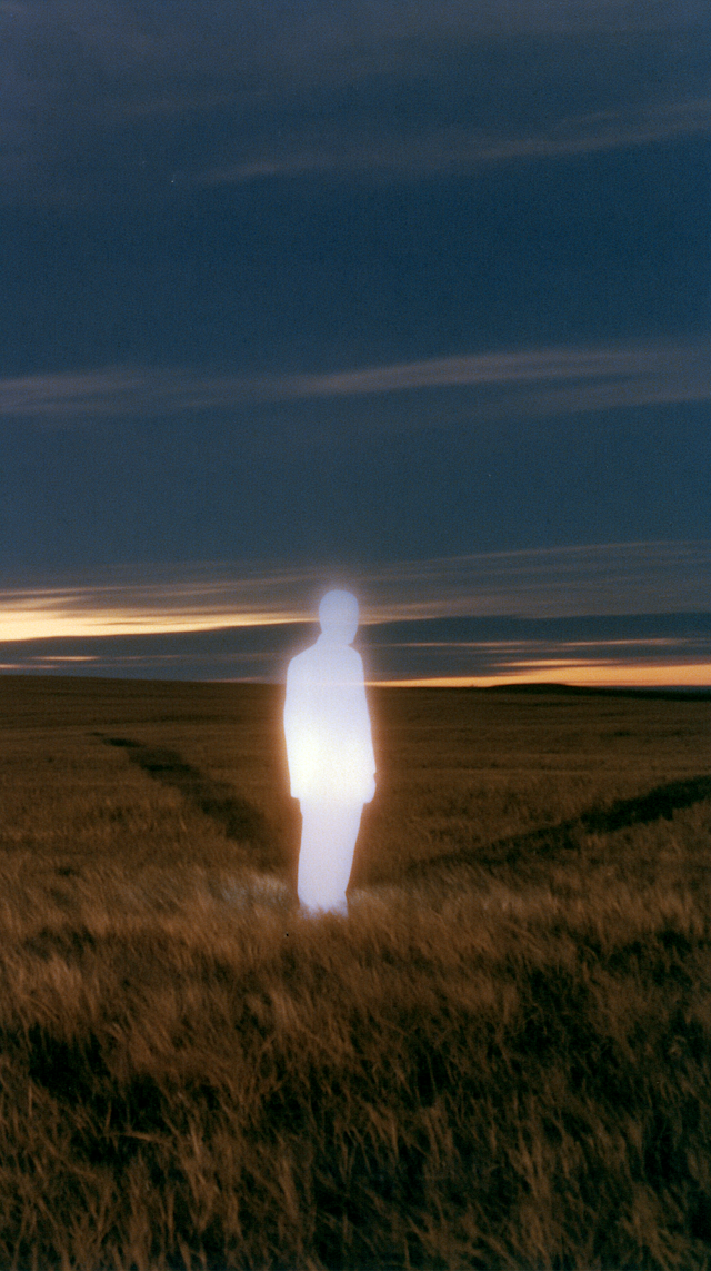 Luminous Solitary Figure in Wheat Field at Dusk