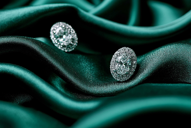 Luxurious Oval Diamond Stud Earrings on Emerald Green Silk