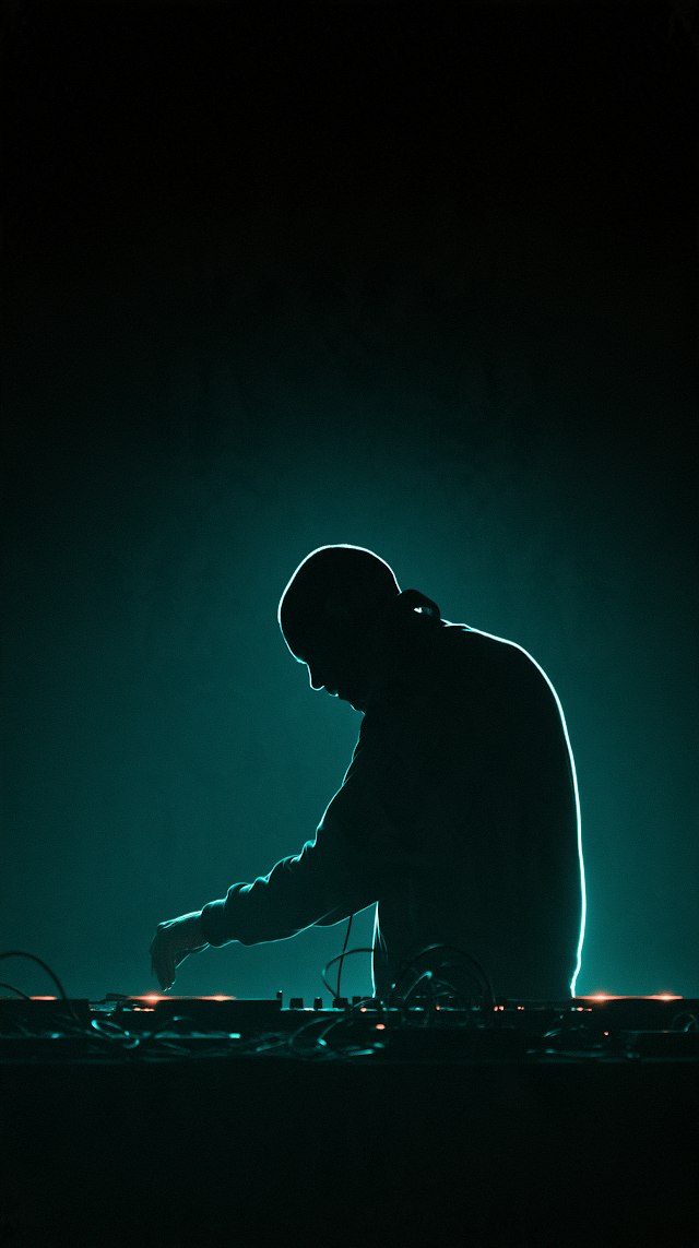 Minimalist Techno DJ Silhouette with Neon Rim Light