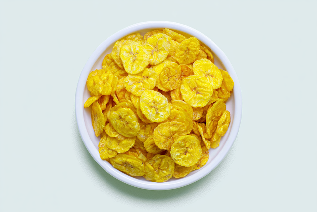 Overhead View of Crispy Banana Chips in a White Bowl