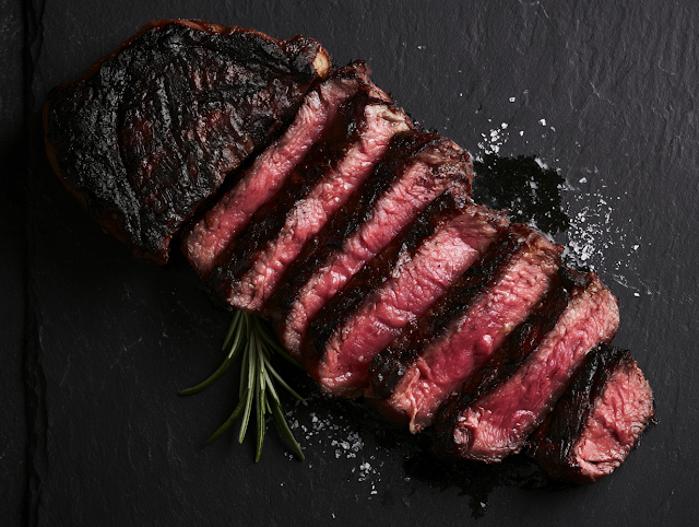 Perfectly Grilled Steak Slices on Slate