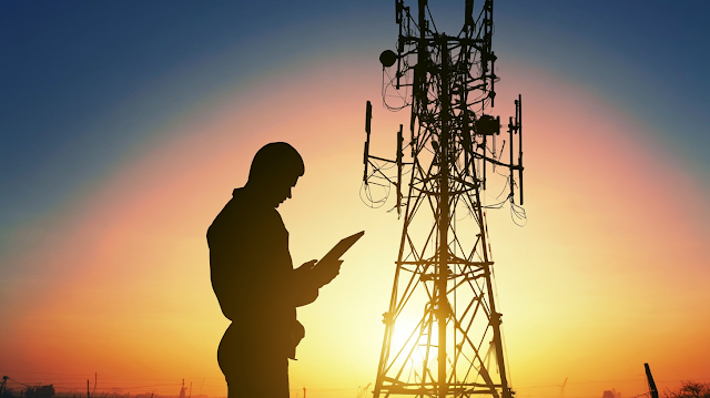 Telecommunications Technician Silhouette at Sunset