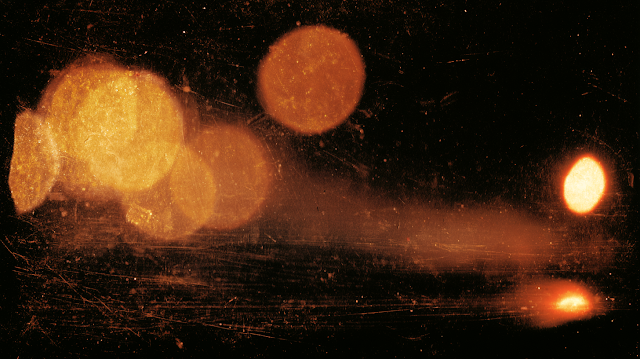 Warm Amber and Gold Bokeh Lights on Black