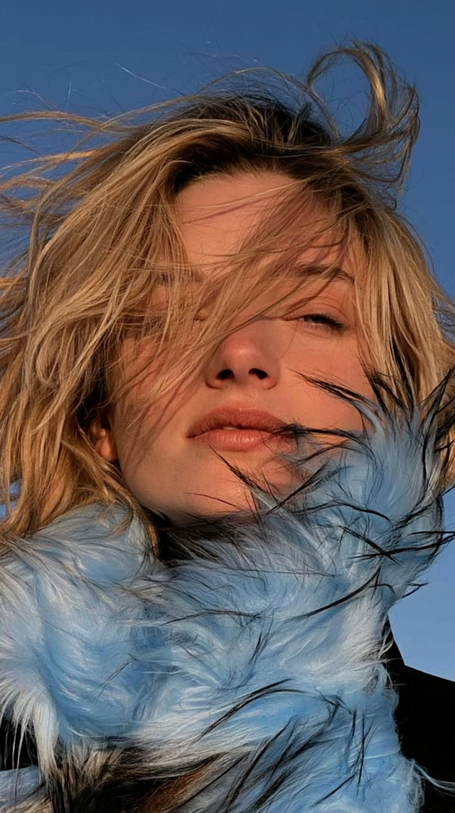 Windswept Blonde Model with Blue Fur Collar